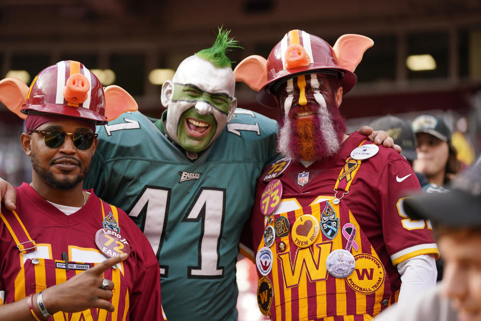 Fans of the Washington Football Team and Philadelphia Eagles in the stands prior to the start of the first half of an NFL football game, Sunday, Jan. 2, 2022, in Landover, Md. (AP Photo/Al Drago)