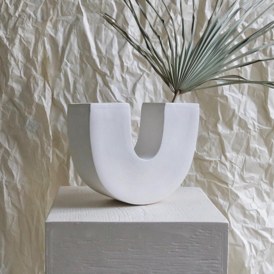 Pair this fat, rounded U-vase with a sharp palm branch for some contrast. SHOP NOW: U-Vase by Rachel Saunders, $250, rachelsaundersceramics.com