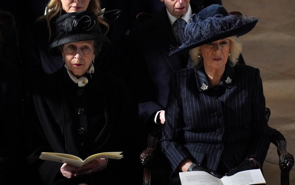 Princess Royal and the Queen looked sombre as they took their seats