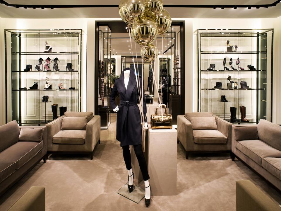 This undated publicity photo provided by BURBERRY shows shoes in an interior view of the new BURBERRY Flagship store opened in November 2012 on Michigan Avenue in Chicago. BURBERRY is interacting directly with consumers in the digital sphere too, launching projects like artofthetrench.com. The website invites users to upload pictures of themselves wearing BURBERRY trench coats. (AP Photo/BURBERRY)
