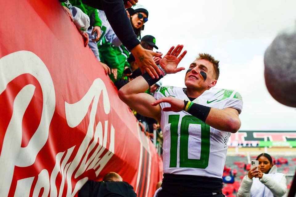 Oregon Ducks quarterback Bo Nix thanks fans after defeating the Utah Utes at Rice-Eccles Stadium.