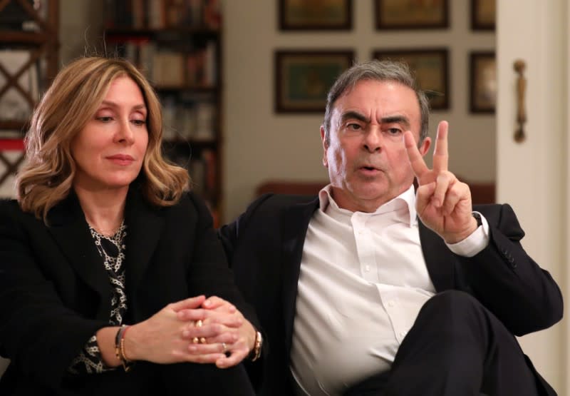 Former Nissan chairman Carlos Ghosn and his wife Carole Ghosn talk during an interview with Reuters in Beirut