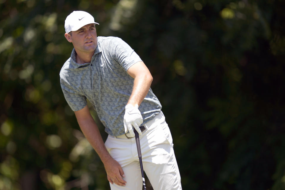 Scottie Scheffler watches his shot on the sixth tee box during the final round of the Charles Schwab Challenge golf tournament at the Colonial Country Club in Fort Worth, Texas, Sunday, May 29, 2022. (AP Photo/LM Otero)