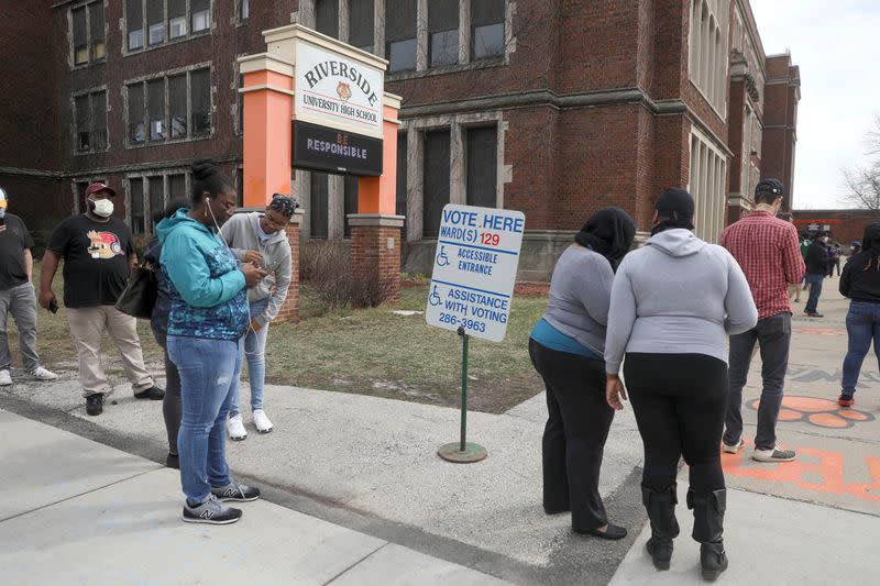 FILE PHOTO: Voters wait to cast ballots during the presidential primary election in Wisconsin