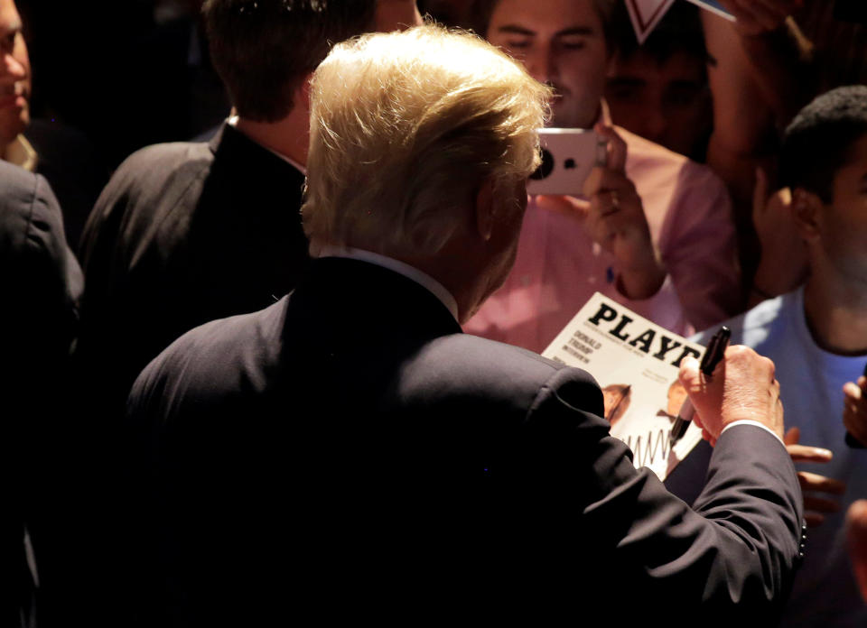 <p>Republican presidential candidate Donald Trump signs a copy of <em>Playboy</em> magazine at a campaign rally in Raleigh, N.C., July 5, 2016. (Photo: Joshua Roberts/Reuters) </p>