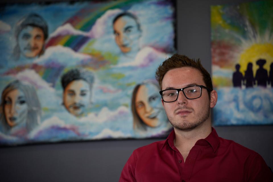 Michael Anderson of Club Q sits for a portrait on Monday, June 5, 2023, in Colorado Springs, Colo. “No one has sympathy for [Anderson Lee Aldrich],” said Anderson, who was bartending at Club Q when the shooting broke out and ducked as several patrons were gunned down around him. “This community has to live with what happened, with collective trauma, with PTSD, trying to grieve the loss of our friends, to move past emotional wounds and move past what we heard, saw and smelled.”