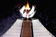 <p>TOKYO, JAPAN - JULY 23: Naomi Osaka of Team Japan lights the Olympic cauldron with the Olympic torch during the Opening Ceremony of the Tokyo 2020 Olympic Games at Olympic Stadium on July 23, 2021 in Tokyo, Japan. (Photo by Laurence Griffiths/Getty Images)</p> 