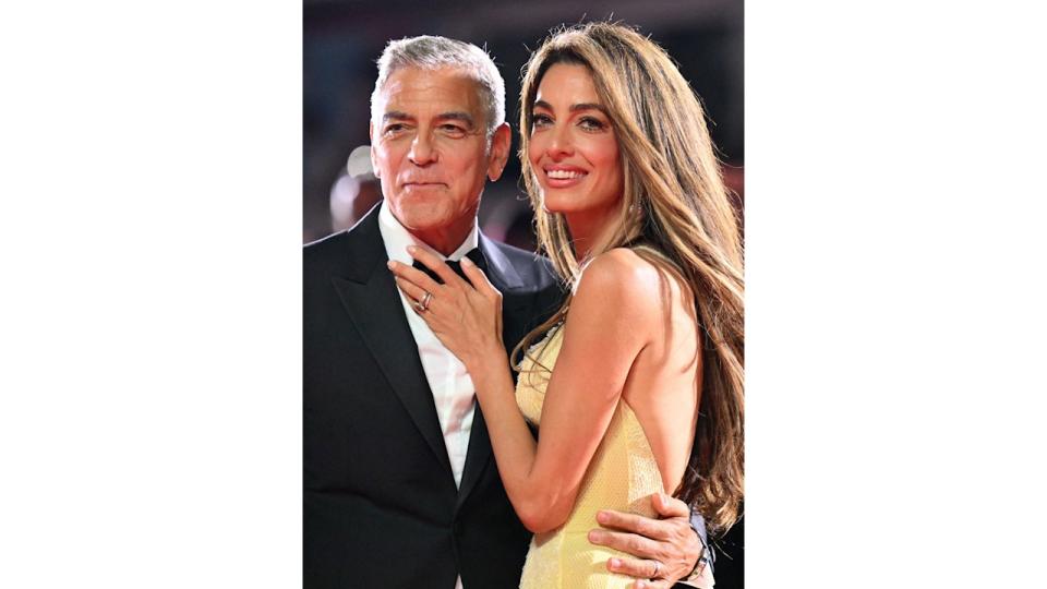 George Clooney and his wife Amal Clooney attend the red carpet of the movie "Wolfs" presented out of competition during the 81st International Venice Film Festival at Venice Lido, on September 1, 2024