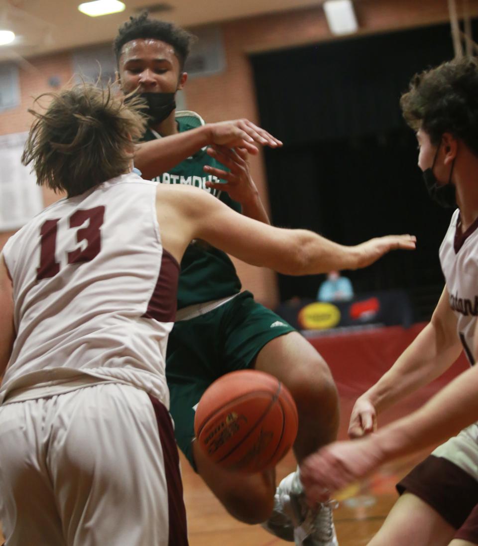 John Emile loses his grip on the ball while under pressure from a pair of defenders Friday in Bishop Stang's 63-49 win over Dartmouth at the John C. O'Brien Gymnasium.
