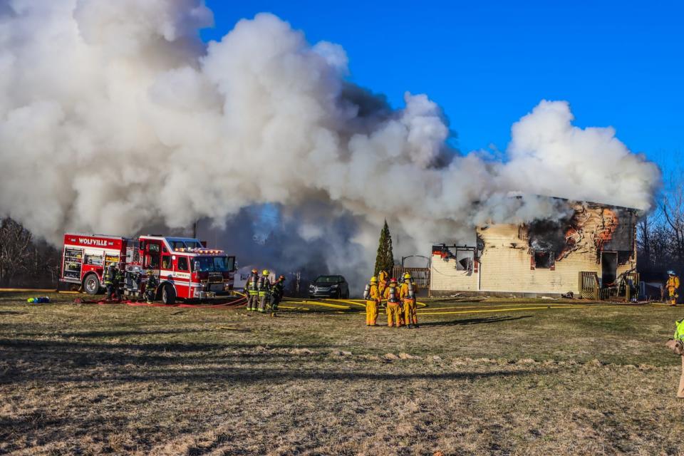 Firefighters attend a house fire on Newtonville Road in Forest Hill, N.S. on April 8, 2024.