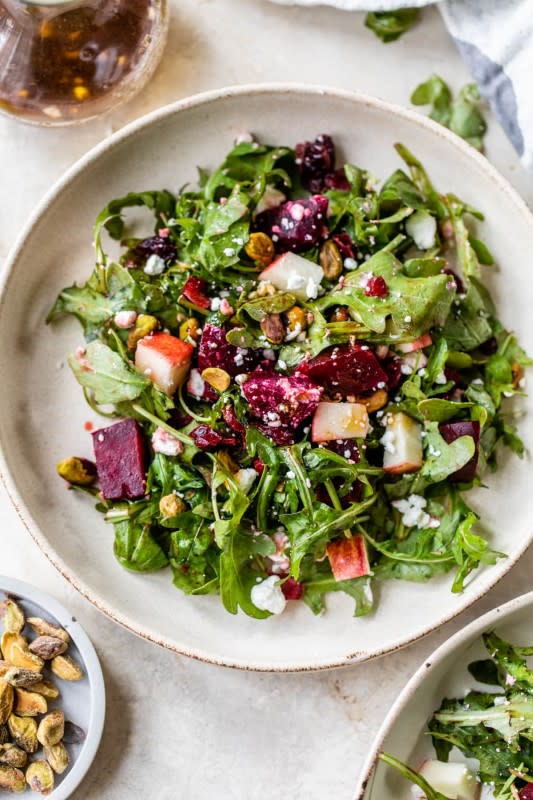 <p>Well Plated</p><p>This delicious roasted beet salad with arugula, apple, cranberries and feta looks stunning and is tossed in an easy balsamic dressing.</p><p><strong>Get the recipe: <a href="https://www.wellplated.com/beet-salad/" rel="nofollow noopener" target="_blank" data-ylk="slk:Balsamic Beet Salad;elm:context_link;itc:0;sec:content-canvas" class="link ">Balsamic Beet Salad</a></strong></p>