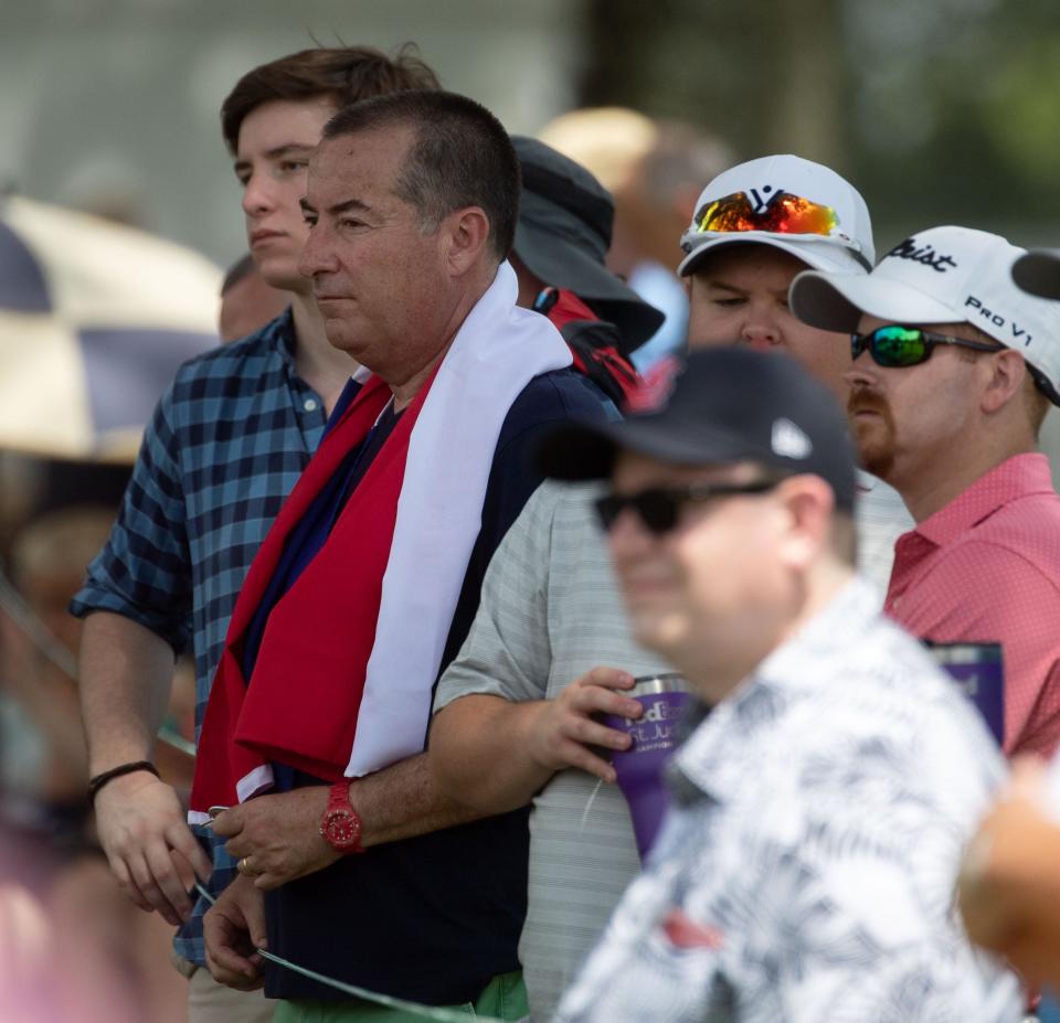 Francisco Soto, front, and his son, Francisco Soto Jr., back, watch their favorite player Joaquin Niemann during the first-round of the FedEx St. Jude Championship on Thursday, Aug. 11, 2022, at TPC Southwind in Memphis.