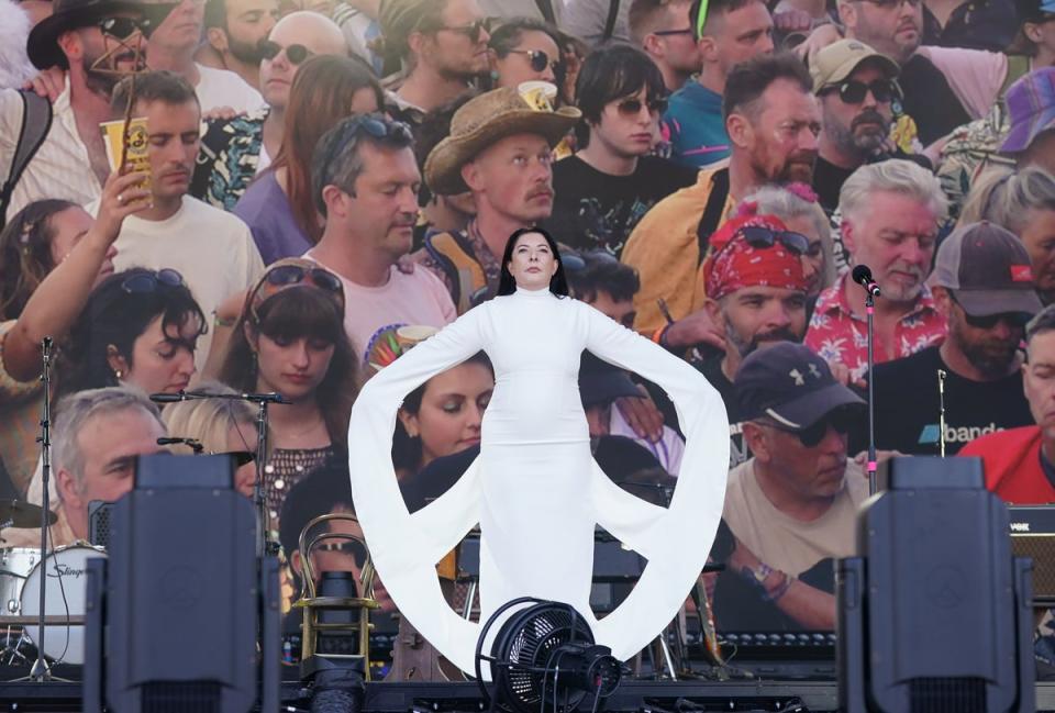 Artist Marina Abramovic doing a ‘public intervention’ on the Pyramid stage (PA)