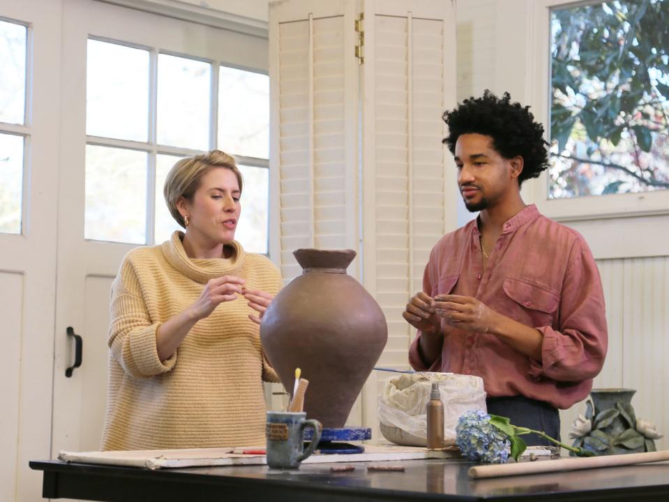 “Home Town” star Erin Napier of Laurel, Miss., talks with Hattiesburg, Miss., artist Vixon Sullivan about a vase he is making for Napier’s client in an April 2022 episode of the HGTV show.