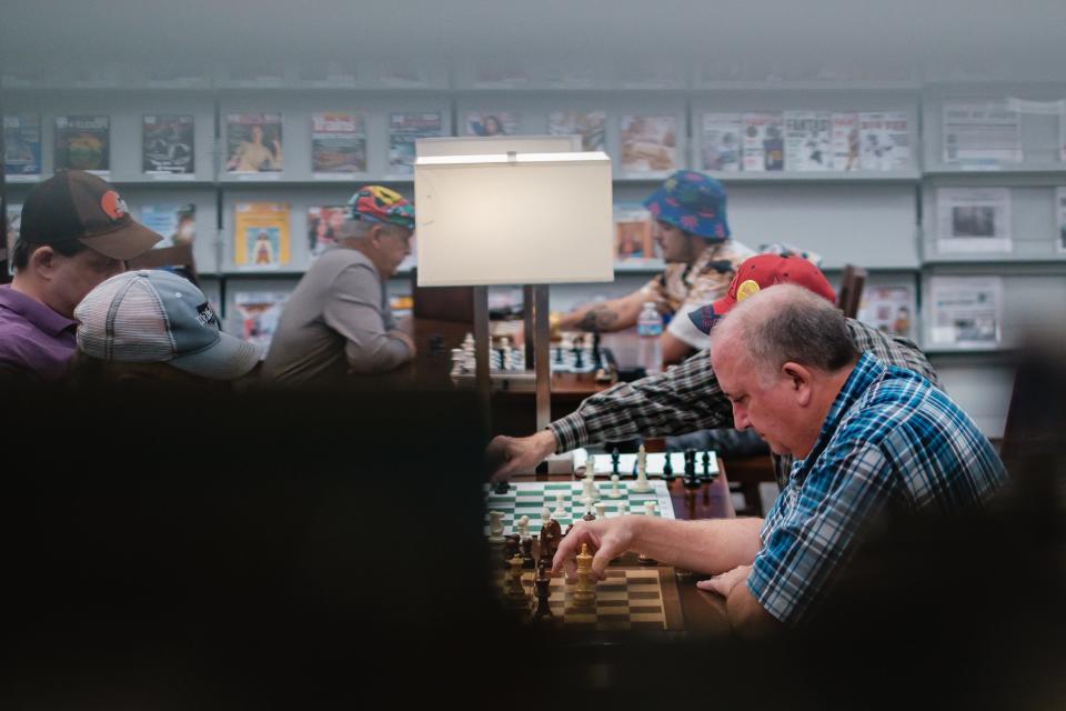 Bill Houghlan, right, of Dover, makes a chess move against his opponent Wednesday, Sept. 27 at the Dover Public Library.