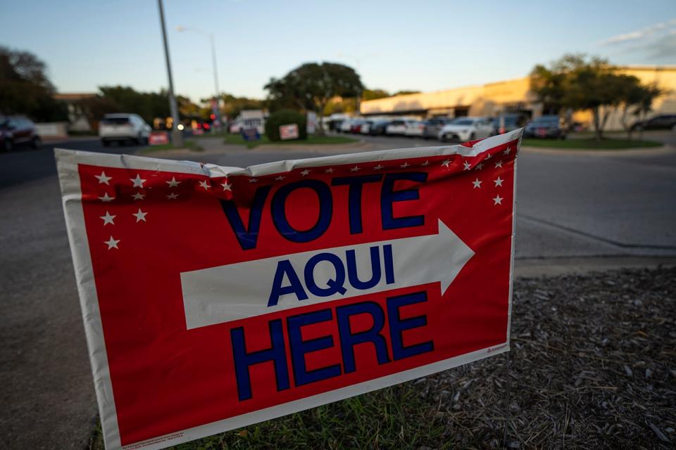 Signs urge people to vote outside Old Quarry Branch Library on Election Day Tuesday, Nov. 7, 2023.