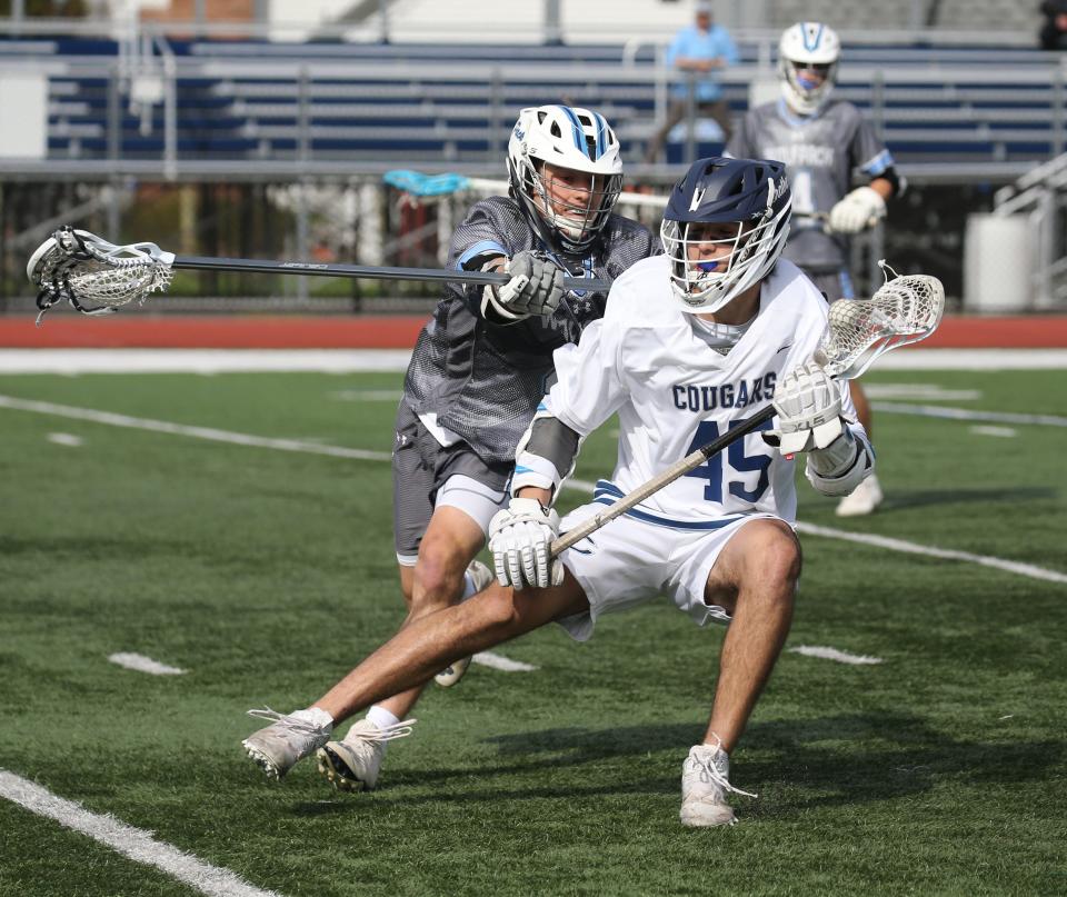 JP Lagunowich of Chatham carries the ball on offense as West Morris upset Chatham 6-4 in boys lacrosse, the Morris County Tournament quarterfinal game played at Chatham on May 5, 2022.