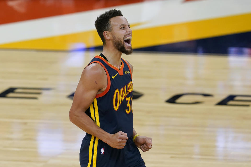 Golden State Warriors guard Stephen Curry reacts during the first half of the team's NBA basketball game against the Boston Celtics in San Francisco, Tuesday, Feb. 2, 2021. (AP Photo/Jeff Chiu)