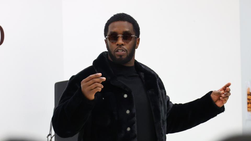 Diddy Wearing Black Coat 