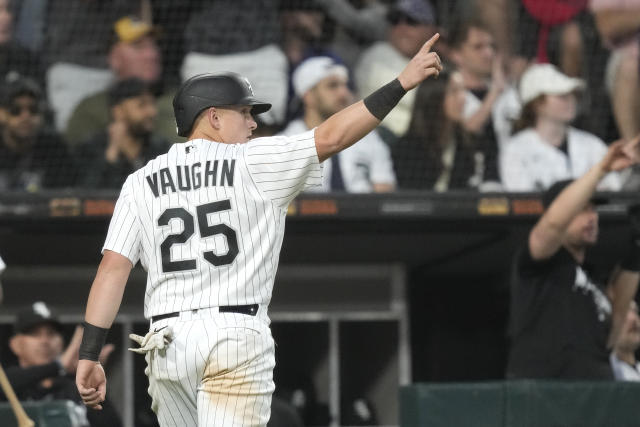 Chicago White Sox' Gavin Sheets, foreground, and Andrew Vaughn, rear, walk  to the dugout after scoring on a double by Romy Gonzalez during the fourth  inning of a baseball game in Cleveland