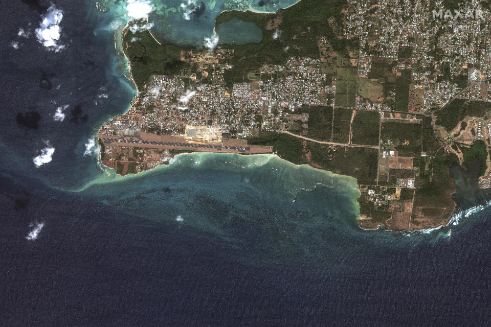 This satellite image provided by Maxar Technologies shows an oil spill caused by an overturned vessel, bottom right, off the coast of Tobago near Scarborough, Trinidad and Tobago, Wednesday, Feb. 14, 2024. (Maxar Technologies via AP)