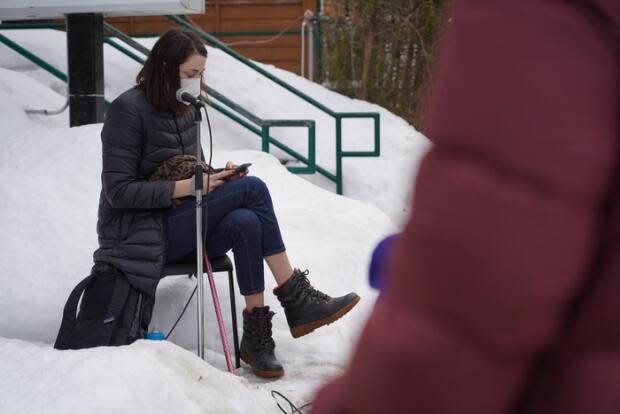 Megan Linton, a disabilities justice advocate photographed here at a protest in February, says people living in these group settings should be fast-tracked higher up the COVID-19 vaccine queue. (Francis Ferland/CBC - image credit)