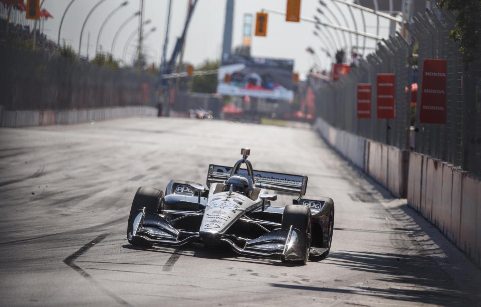 Simon Pagenaud, of France, drives his way to first place at the Honda Indy auto race in Toronto, Sunday, July 14, 2019. (Mark Blinch/The Canadian Press via AP)