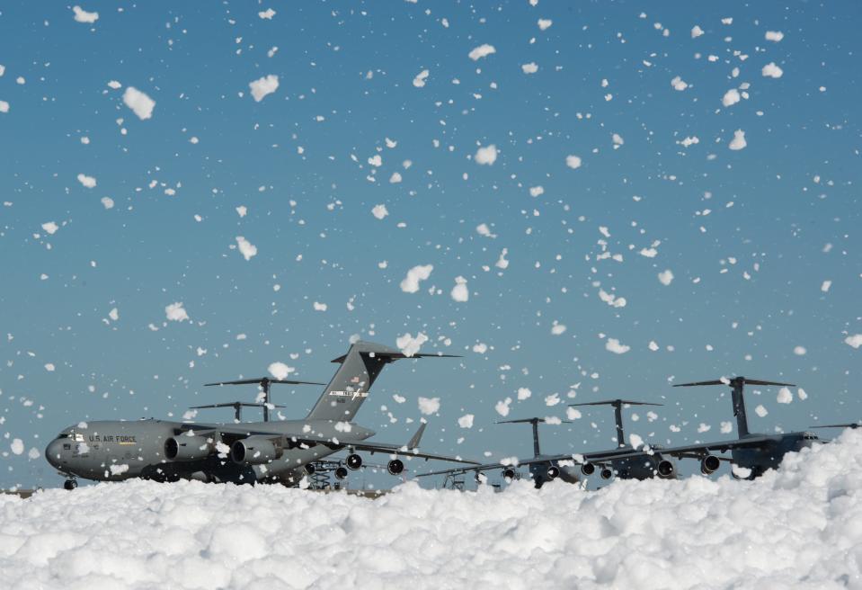 Fire-retardant foam temporarily covered a small portion of the flight line at Travis Air Force Base in California after it was released inside a hangar on Sept. 24, 2013.