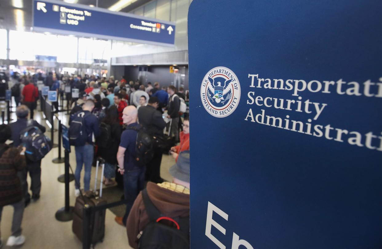 Passengers at O'Hare International Airport wait in line to be screened at a Transportation Security Administration (TSA) checkpoint on May 16, 2016 in Chicago, Illinois. (Photo by Scott Olson/Getty Images)