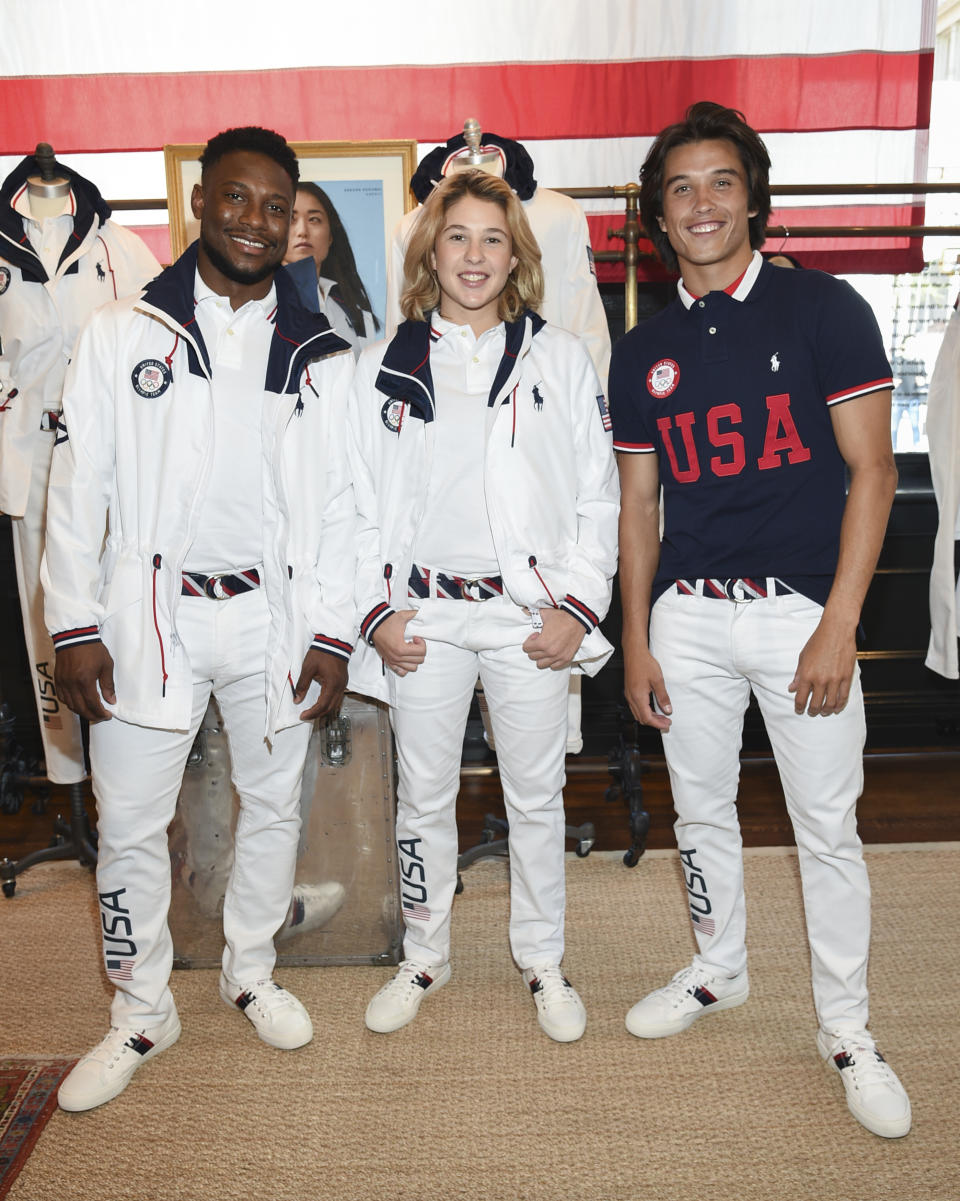 Athletes Daryl Homer (Fencing), left, Jordyn Barratt (Skateboard) and Heimana Reynolds (Skateboard) participate in the Team USA Tokyo Olympic closing ceremony uniform unveiling at the Ralph Lauren SoHo Store on April 13, 2021, in New York. Ralph Lauren is an official outfitter of the 2021 U.S. Olympic Team. (Photo by Evan Agostini/Invision/AP)