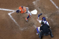 Houston Astros' Jose Altuve, left, avoids a close pitch as Texas Rangers catcher Jonah Heim catches the ball during the fourth inning in Game 4 of the baseball American League Championship Series Thursday, Oct. 19, 2023, in Arlington, Texas. (AP Photo/Godofredo A. Vasquez)