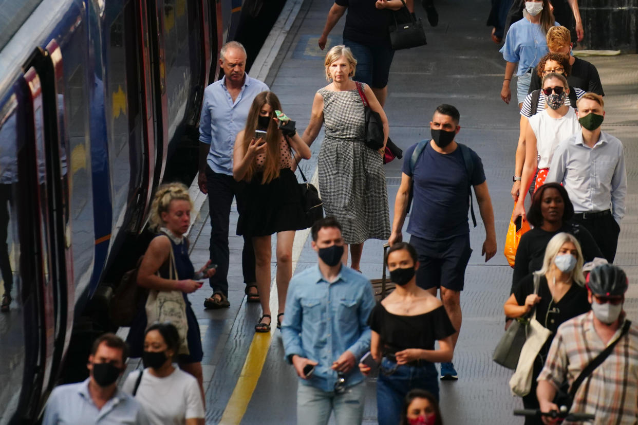 Commuters, some not wearing facemasks, at Waterloo Station at 0909 in London after the final legal Coronavirus restrictions were lifted in England. Picture date: Monday July 19, 2021.