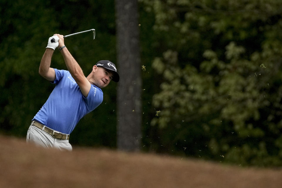 Brian Harman hits from the fairway on the 11th hole during the second round of the Masters golf tournament on Friday, April 9, 2021, in Augusta, Ga. (AP Photo/Charlie Riedel)