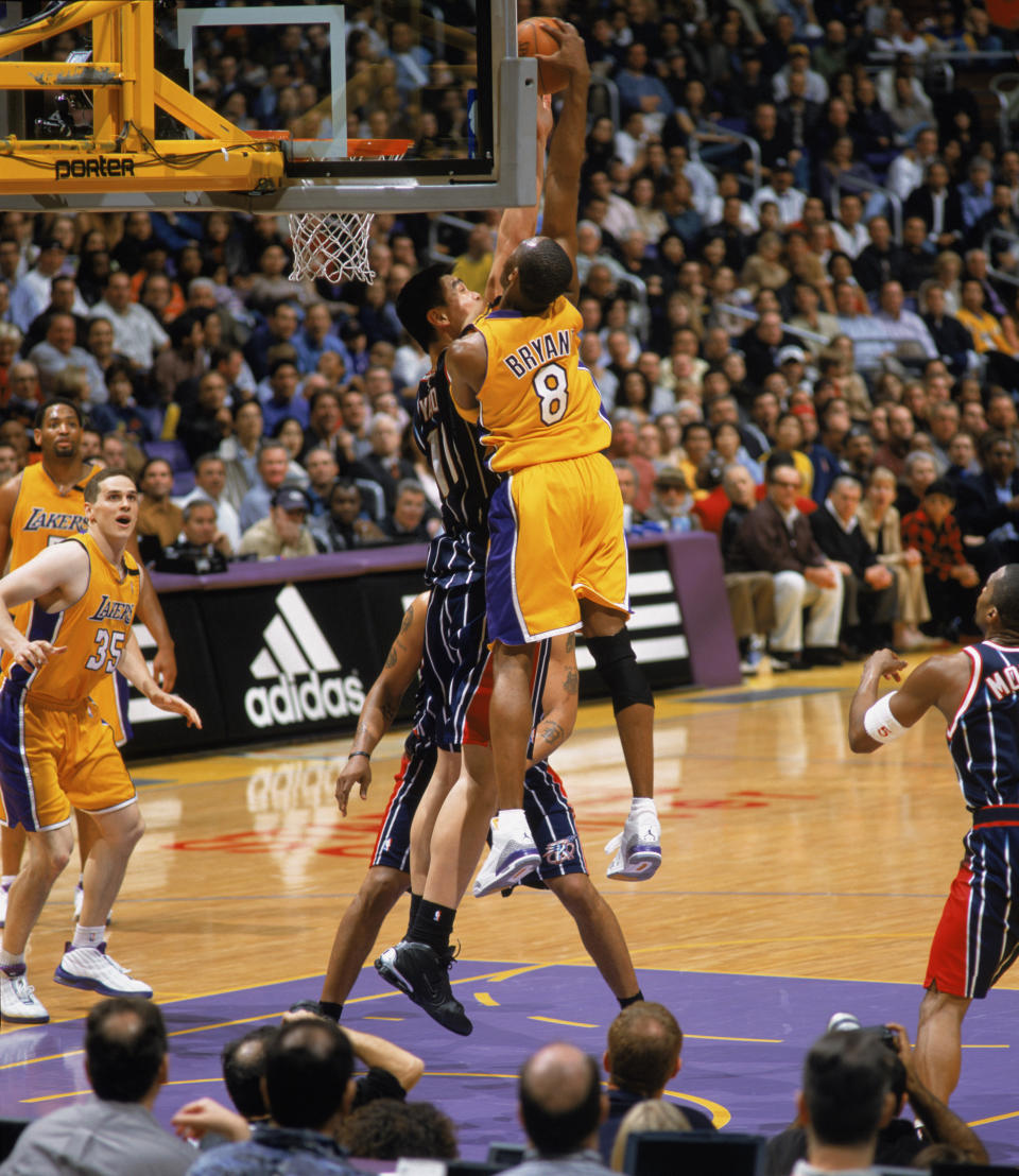 Bryant dunks over seven-foot-six-inch Yao Ming of the Houston Rockets on Feb.&nbsp;18, 2003.