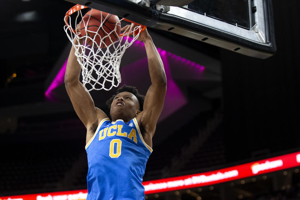 UCLA guard Jaylen Clark dunks against Bellarmine during the first half of an NCAA college basketball game Monday, Nov. 22, 2021, in Las Vegas. (AP Photo/Ellen Schmidt)