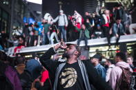 Toronto Raptors supporters celebrate in the streets after the Raptors defeated the Golden State Warriors during Game 6 NBA Finals to win the NBA Championship, in Toronto on Thursday, June 13, 2019. (Christopher Katsarov/The Canadian Press via AP)