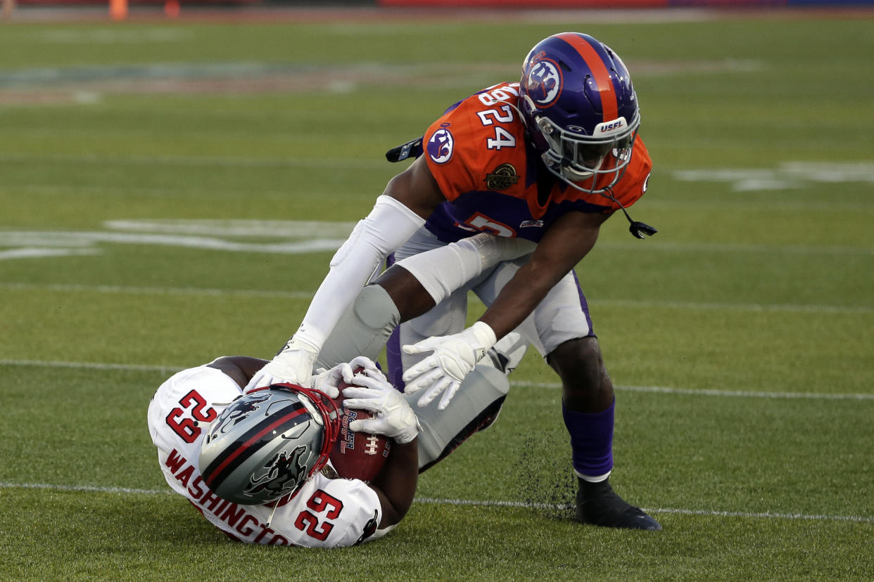 Tampa Bay Bandits running back Juwan Washington (29) is tackled by Pittsburgh Maulers defensive back Jaylon McClain-Sapp (24) during the first half of a USFL football game Monday, April 18, 2022, in Birmingham, Ala. (AP Photo/Butch Dill)
