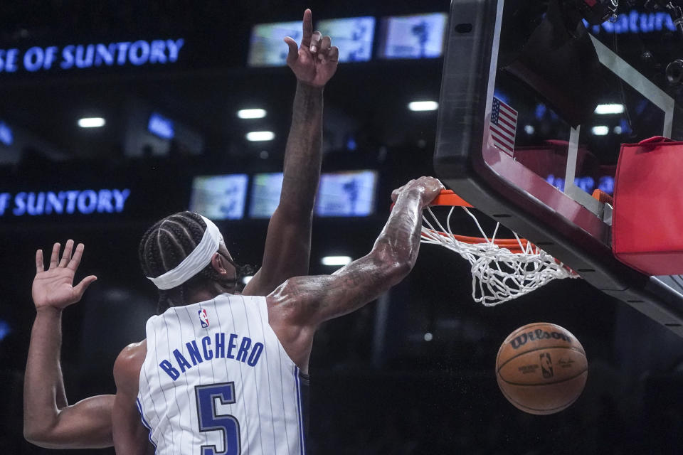 Orlando Magic's Paolo Banchero (5) dunks during the second period of an NBA basketball game the against Brooklyn Nets, Saturday, Dec. 2, 2023, in New York. (AP Photo/Bebeto Matthews)