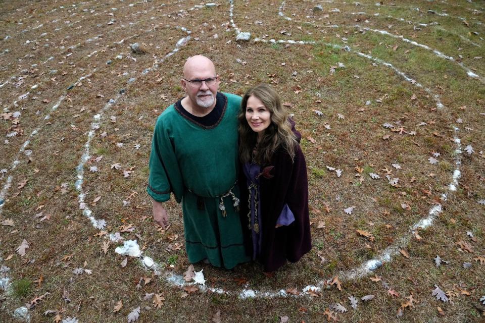 Gail McHugh, senior clergy and founder of Horn and Cauldron Church of the Earth, and her husband, Darrell Moore, co-senior clergy, stand inside a sacred labyrinth circle used with their congregants during services. The church is sponsoring Rhode Island Pagan Pride Day in Johnston on August 26.
