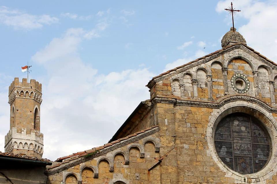 A view of the tower of 'Palazzo dei Priori' and the Cathedral in Volterra, Italy.