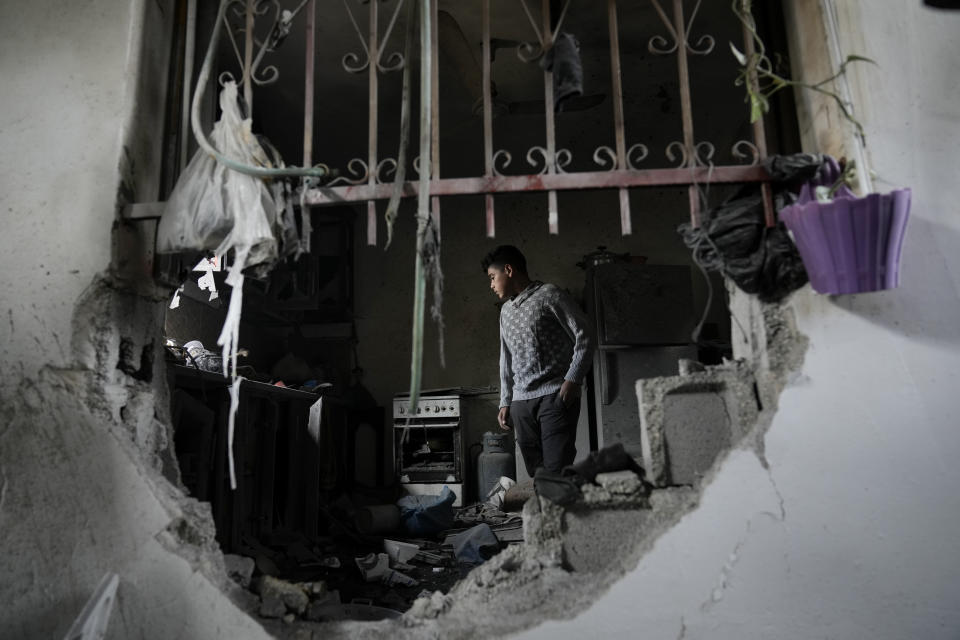 Palestinians inspect a house destroyed by Israeli forces during a military raid in the West Bank town of Tubas, Tuesday, Nov. 28, 2023. (AP Photo/Majdi Mohammed)