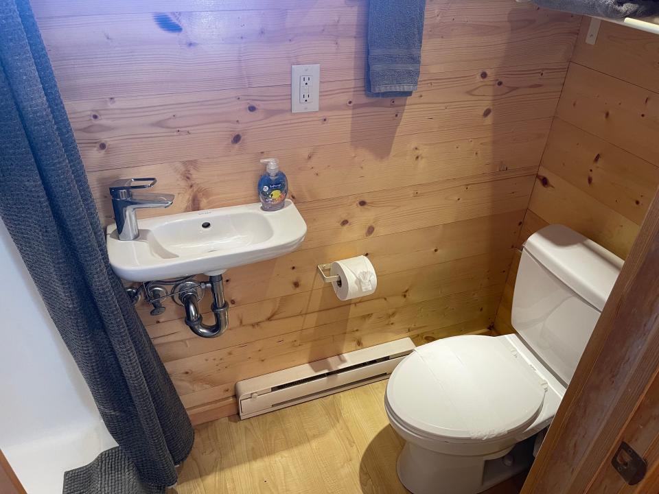 bathroom area with toilet and sink in tiny home airbnb near disneyland