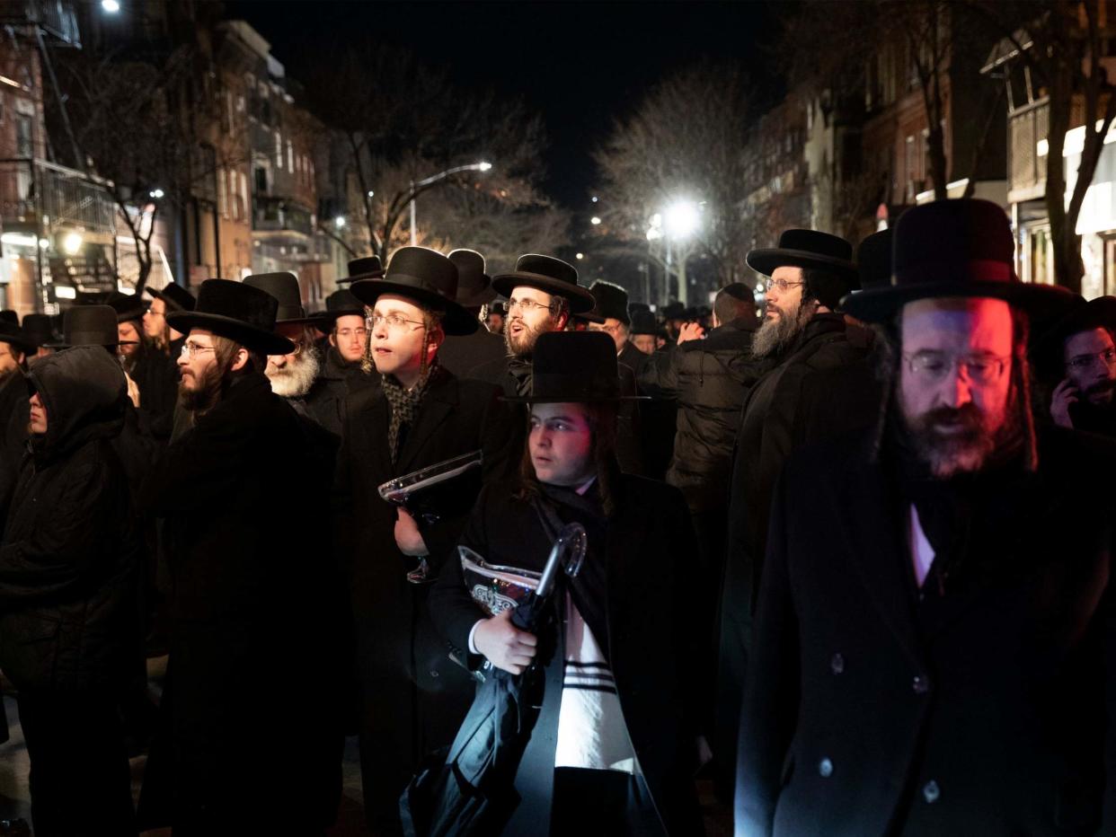 Jewish mourners come together following the Tuesday shooting in Jersey City: AP