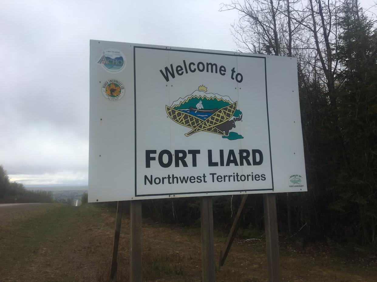 A photo of the Fort Liard sign. The highway south of the community in northern B.C. has been reduced to single lane traffic due to poor visibility from smoke. (Alex Brockman/CBC - image credit)