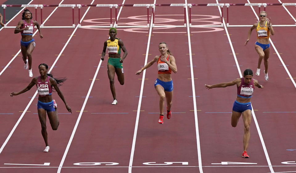 Sydney Mclaughlin, of United States wins the gold medal in the final of the the women's 400-meter hurdles ahead of Dalilah Muhammad, of United States, silver, and Femke Bol, of Netherlands, bronze, at the 2020 Summer Olympics, Wednesday, Aug. 4, 2021, in Tokyo, Japan. (AP Photo/Charlie Riedel)