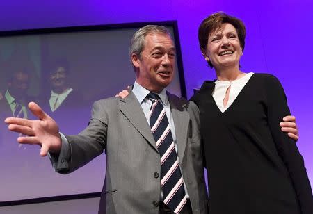 Nigel Farage (L), the outgoing leader of the United Kingdom Independence Party (UKIP), congratulates new leader Diane James, at the party's annual conference in Bournemouth, Britain, September 16, 2016. REUTERS/Toby Melville