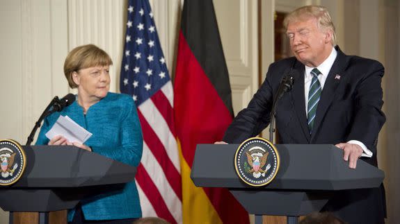 Mandatory Credit: Photo by REX/Shutterstock (8523309l) United States President Donald J. Trump answers a German reporter's question about wiretapping as he and Chancellor Angela Merkel of Germany conduct a joint press conference in the East Room of the White House German Chancellor Angela Merkel visit to Washington DC, USA - 17 Mar 2017