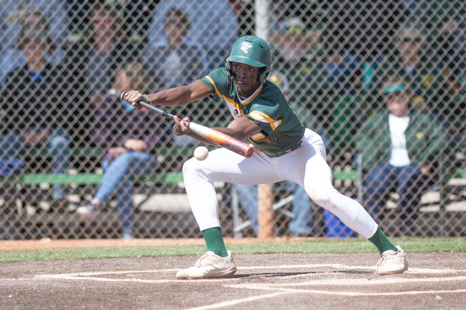 Pueblo County's Braxton Vail connects on a bunt during a game against Pueblo South at the Runyon Sports Complex on Saturday, April 15, 2023.