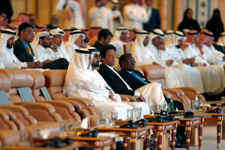 Prime Minister and Vice-President of the United Arab Emirates and ruler of Dubai Sheikh Mohammed bin Rashid al-Maktoum, Imran Khan, Prime Minister of Pakistan,Saudi Arabia Minister of State Ibrahim Abdulaziz Al-Assaf, attend the investment conference in Riyadh, Saudi Arabia October 23, 2018. REUTERS/Faisal Al Nasser