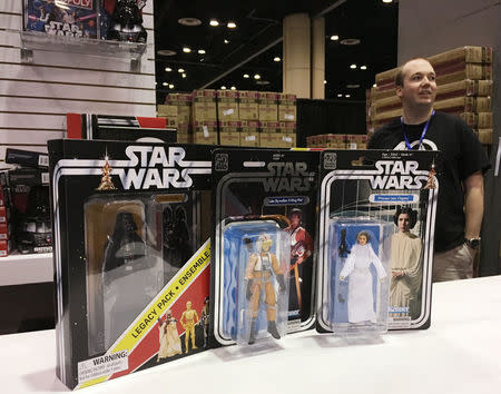 Star Wars products are lined up at the annual Star Wars Celebration where Walt Disney Co licensees are selling a new Luke Skywalker action figure, limited-edition Stormtrooper helmets and other coveted merchandise, in Orlando, Florida, U.S., April 14, 2017. REUTERS/Zach Fagenson